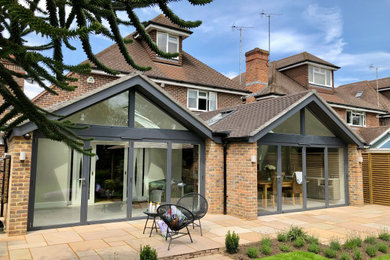 Example of a trendy home design design in Surrey