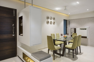 Inspiration for a transitional dining room remodel in Mumbai