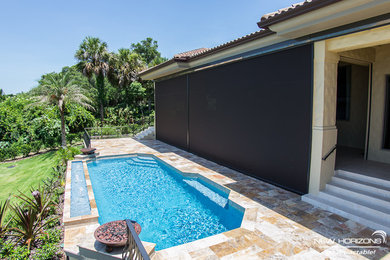 Retractable screens & sunshades protect this Windermere, FL home from strong sun