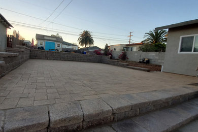 Example of a mid-sized mountain style backyard concrete paver patio design in San Francisco