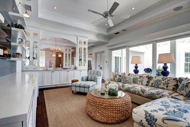 Inspiration for a mid-sized timeless enclosed dark wood floor and brown floor living room remodel in Miami with blue walls, no fireplace and no tv