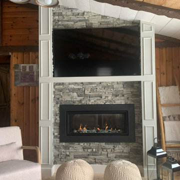 Fireplace Design In Living Room With Faux Stone Panels