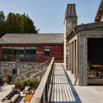 Weathered Gray and Antique Red Barnwood Paneling on Farmhouse Courtyard Walkway