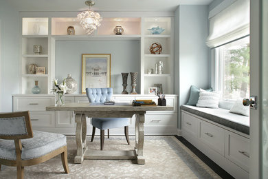 Photo of a transitional home office in New York with blue walls.