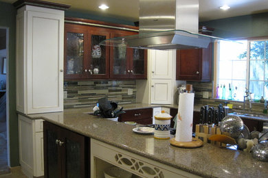 Inspiration for a large eclectic l-shaped porcelain tile eat-in kitchen remodel in Other with beaded inset cabinets, white cabinets, quartzite countertops, green backsplash, glass tile backsplash, stainless steel appliances and two islands
