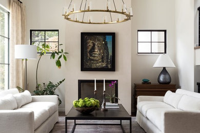 Inspiration for a transitional dark wood floor and brown floor living room remodel in DC Metro with beige walls and a standard fireplace