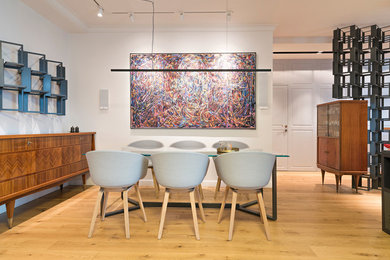Inspiration for a modern light wood floor and beige floor kitchen/dining room combo remodel in Other with a standard fireplace