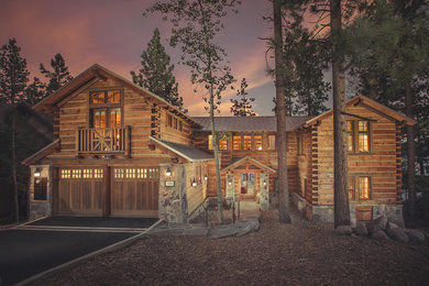 Example of a large mountain style brown two-story wood exterior home design in San Francisco with a metal roof