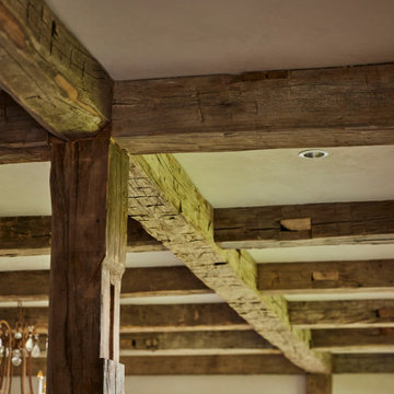 Hand Hewn Timbers in Farmhouse Dining Room Ceiling