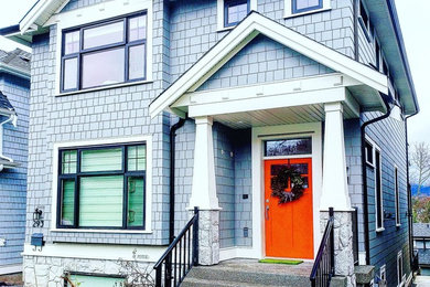 Mid-sized minimalist gray three-story mixed siding house exterior photo in Vancouver with a shingle roof