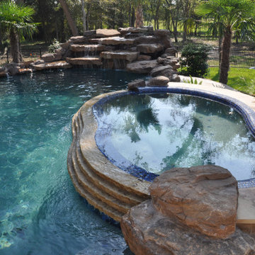 Spa Stacked Stone Spillway with Moss Rock Waterfall