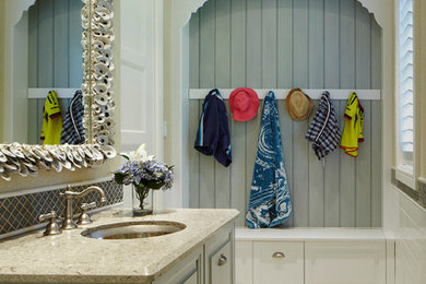 Photo of a mid-sized beach style kids bathroom in Miami with multi-coloured tile and granite benchtops.