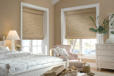 Bedroom - mid-sized coastal master carpeted bedroom idea in Other with beige walls and no fireplace