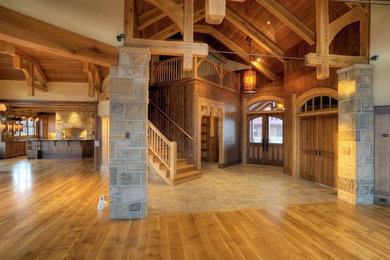 Entryway - huge craftsman medium tone wood floor entryway idea in Other with beige walls and a dark wood front door