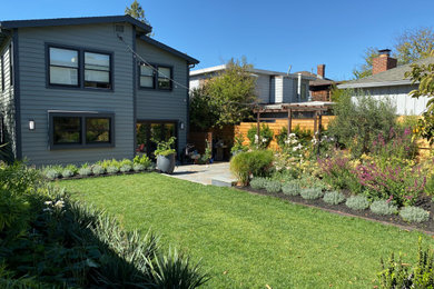 Photo of a traditional backyard full sun garden for summer in San Francisco with natural stone pavers.