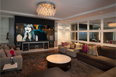 Example of a mid-sized classic enclosed carpeted game room design in Vancouver with beige walls and a concealed tv