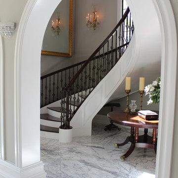 Walnut Circular Stair with Twist & Basket Iron Balusters