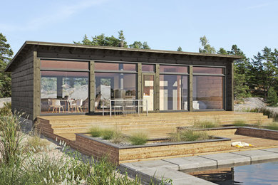 Example of a trendy one-story wood exterior home design in Le Havre with a shed roof
