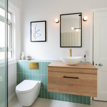 Contemporary, colourful renovation including bespoke kitchen and sage/brass bath