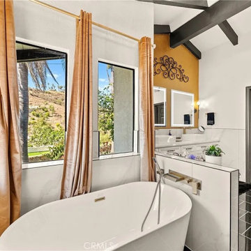 Freestanding Tub with Mountain View in Luxury Primary Bathroom