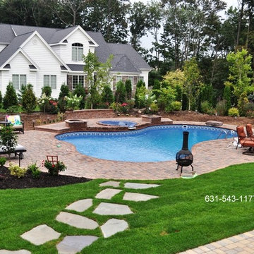 Landscaped Backyard Design with Free Form Vinyl Pool, Spillover Spa, Patio, Step