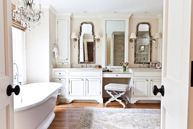 Freestanding bathtub - traditional freestanding bathtub idea in Charleston with beaded inset cabinets and white cabinets