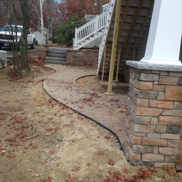 Lakeside patio with stone column bases