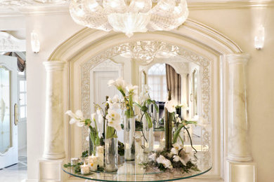 Inspiration for a large contemporary marble floor entryway remodel in Other with beige walls