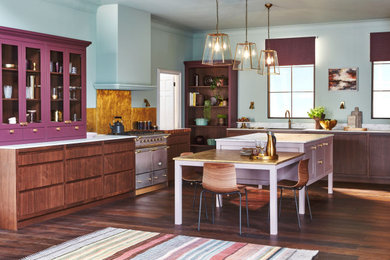 Photo of a large traditional u-shaped open plan kitchen in Other with flat-panel cabinets and an island.