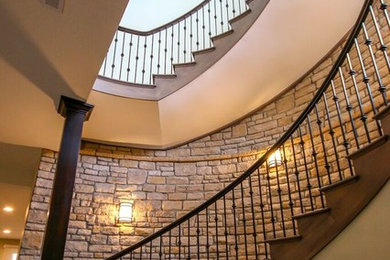 Staircase - large transitional wooden curved staircase idea in Other