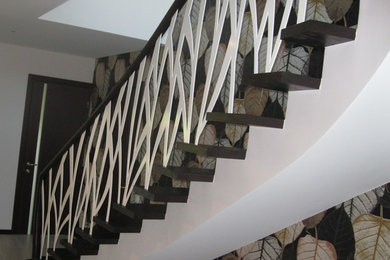 Staircase - contemporary staircase idea in Other