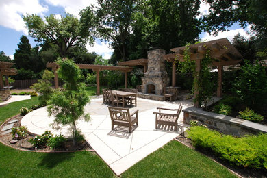 Patio - huge craftsman backyard stamped concrete patio idea in San Francisco with a fire pit and a pergola