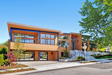 Inspiration for a contemporary two-story wood exterior home remodel in Seattle