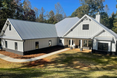 Example of a farmhouse exterior home design in Atlanta