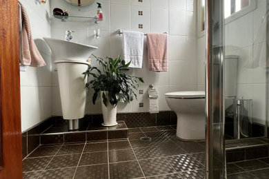 Photo of a small contemporary kids bathroom in Sydney with white cabinets, a corner shower, a one-piece toilet, white tile, ceramic tile, white walls, porcelain floors, a pedestal sink, grey floor, a hinged shower door, a single vanity, a freestanding vanity, vaulted and decorative wall panelling.