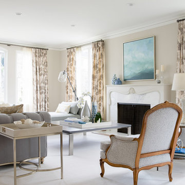 Layered Living Room with Carved Wood Fireplace and Tufted Seating