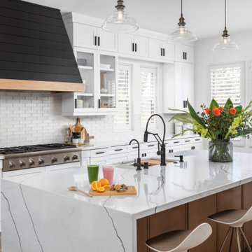 Quartz Waterfall Countertop Drapes Down on Side of Island