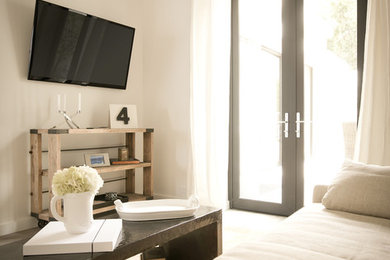 Large trendy open concept family room photo in Los Angeles with white walls and a wall-mounted tv