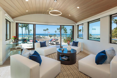 Family room - mid-sized contemporary loft-style beige floor family room idea in Orange County with beige walls