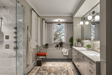 Design ideas for a transitional bathroom in Other with flat-panel cabinets, grey cabinets, an undermount tub, gray tile, beige walls, an undermount sink, grey floor and beige benchtops.