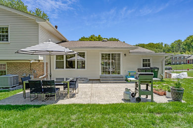 Backyard stamped concrete patio photo in DC Metro with a bbq area and no cover