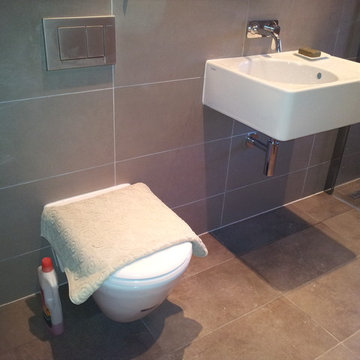 Concealed cistern and floating wash hand basin