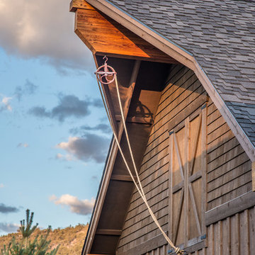 Brasada Ranch home barn style garage including rope pully to faux hay loft