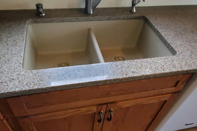 Inspiration for a mid-sized timeless u-shaped vinyl floor and brown floor eat-in kitchen remodel in Other with shaker cabinets, medium tone wood cabinets, quartz countertops, no island, beige countertops, an undermount sink and stainless steel appliances