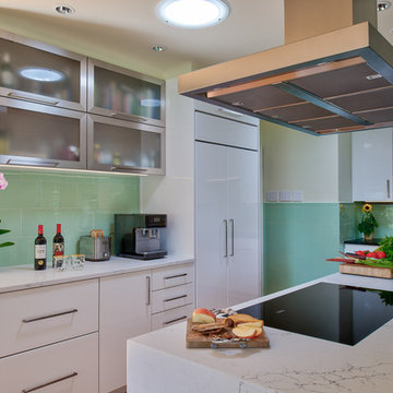 Marble Waterfall Counters and a Floating Range Hood