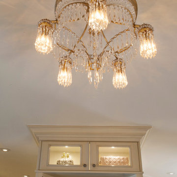 Custom Couture Master Closet in Winnetka with Lighted Glass Door Display Cabinet