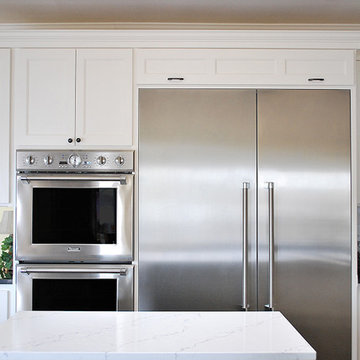 Cabinet door above refrigerator closed