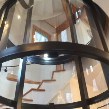 Round Acrylic Home Elevator Incorporated into Staircase