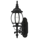 Livex Lighting - Textured Black Traditional, Colonial, French Historical, Outdoor Wall Lantern - The classically transitional outdoor Frontenac collection boasts a cast aluminum structure with dazzling ornamental design.  The upward facing single-light small six-sided wall lantern comes in a textured black finish with clear beveled glass and extravagantly decorative scrolls. The ornate quality of this light will add radiance to your house exterior day or night.