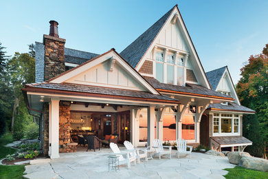 Patio - large backyard stone patio idea in Minneapolis with no cover